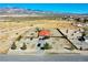 Well-maintained home with a vibrant red roof and manicured landscaping offers a serene suburban lifestyle at 2801 Peggy Ave, Pahrump, NV 89048