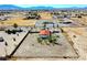 Picturesque neighborhood with a well-maintained home, highlighted by its striking red roof and mature trees at 2801 Peggy Ave, Pahrump, NV 89048