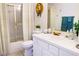 Well-lit bathroom with white countertops, shower with glass doors, and decorative sunflower wreath at 2801 Peggy Ave, Pahrump, NV 89048