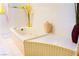 Close-up of a relaxing bathtub with stylish tile work and elegant decorative accents at 2801 Peggy Ave, Pahrump, NV 89048