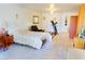Bright bedroom featuring a comfortable bed, chair, and access to an ensuite bathroom at 2801 Peggy Ave, Pahrump, NV 89048