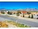 Charming single-story home features a bright red roof, complemented by the mature landscaping at 2801 Peggy Ave, Pahrump, NV 89048