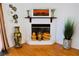 Charming fireplace with decorative vases and artwork creating a cozy ambiance at 2801 Peggy Ave, Pahrump, NV 89048