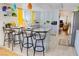 Bright kitchen with modern stools, white cabinets, and great light at 2801 Peggy Ave, Pahrump, NV 89048