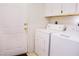 Functional laundry room with modern washer and dryer units at 2801 Peggy Ave, Pahrump, NV 89048