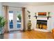 Comfortable living room with fireplace, decor, and access to outdoor patio at 2801 Peggy Ave, Pahrump, NV 89048