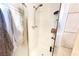 Shower featuring white tile, a glass door, and modern fixtures with bathroom products at 2801 Peggy Ave, Pahrump, NV 89048