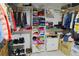 Walk-in closet with ample storage, shelving, hanging rods, and organized clothing at 2801 Peggy Ave, Pahrump, NV 89048