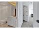 Well-lit bathroom featuring modern vanity and fixtures; entry into bright carpeted bedroom at 2877 Paradise Rd # 2704, Las Vegas, NV 89109