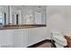 Modern bathroom featuring a large mirror over the sink, with an adjacent toilet at 2877 Paradise Rd # 2704, Las Vegas, NV 89109