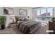 Comfortable bedroom with soft rug, grey colored bedding, and bedside table at 2877 Paradise Rd # 2704, Las Vegas, NV 89109