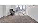 Bright carpeted bedroom with floor to ceiling windows and massage chair, offering panoramic views at 2877 Paradise Rd # 2704, Las Vegas, NV 89109