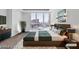 Modern bedroom with a view of the city outside the floor to ceiling windows at 2877 Paradise Rd # 2704, Las Vegas, NV 89109