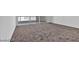 Spacious bedroom with plush carpeting, modern sliding glass doors and a view at 2877 Paradise Rd # 2704, Las Vegas, NV 89109