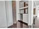 Hallway features a custom-built bar with a granite countertop and a built-in wine fridge, accented by light-colored walls at 2877 Paradise Rd # 2704, Las Vegas, NV 89109