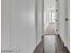 Hallway with wood floors leading to a carpeted area with abundant natural light at 2877 Paradise Rd # 2704, Las Vegas, NV 89109