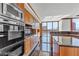 Modern kitchen featuring sleek appliances, granite countertops, custom cabinetry, and city views at 2877 Paradise Rd # 2704, Las Vegas, NV 89109