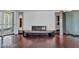 Minimalist living room featuring a modern fireplace, hardwood floors, and large windows offering great natural light at 2877 Paradise Rd # 2704, Las Vegas, NV 89109
