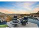 Relaxing backyard with comfortable seating areas, pool, and stunning sunset views at 3000 Raywood Ash Dr, Las Vegas, NV 89138