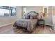 Bedroom with detailed headboard, side tables with lamps and hard wood flooring at 3000 Raywood Ash Dr, Las Vegas, NV 89138