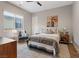 Serene bedroom featuring a comfortable bed, soft lighting, and a window with an outside view at 3000 Raywood Ash Dr, Las Vegas, NV 89138