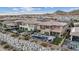 A luxurious backyard with a sparkling pool, cozy seating, and lush landscaping at 3000 Raywood Ash Dr, Las Vegas, NV 89138