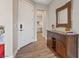 Inviting foyer with elegant details, a stylish cabinet, and wood-look flooring at 3000 Raywood Ash Dr, Las Vegas, NV 89138