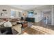 Sunlit living room with hardwood floors, a cozy sofa, and stylish decor at 3000 Raywood Ash Dr, Las Vegas, NV 89138