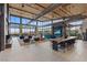 Bright, expansive lounge area with modern furniture, high ceilings, a fireplace and scenic windows at 3000 Raywood Ash Dr, Las Vegas, NV 89138