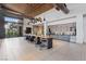 Interior view of large lounge area with a long table, cabinets and stainless steel appliances at 3000 Raywood Ash Dr, Las Vegas, NV 89138