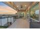Covered patio with ceiling fan offers seamless transition to the pool and stunning sunset views at 3000 Raywood Ash Dr, Las Vegas, NV 89138