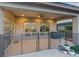 Covered patio with ceiling fan offers a relaxing outdoor space with views of the surrounding community at 3000 Raywood Ash Dr, Las Vegas, NV 89138