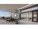 Large outdoor patio with seating, a grill, and sliding glass doors leading to the interior at 3000 Raywood Ash Dr, Las Vegas, NV 89138