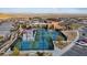 Aerial view of blue and green pickleball courts in a community with mountain views at 3000 Raywood Ash Dr, Las Vegas, NV 89138