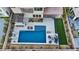 Aerial view of a modern pool and patio area featuring lounge chairs, a pergola, and outdoor seating at 3000 Raywood Ash Dr, Las Vegas, NV 89138