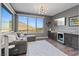 Sitting room with view, gray sofa and small bar with beverage refrigerator at 3000 Raywood Ash Dr, Las Vegas, NV 89138