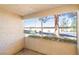 View of the outdoors from the enclosed balcony provides natural light and creates a cozy outdoor space at 3123 Key Largo Dr # 101, Las Vegas, NV 89120