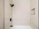 Bathroom showcasing white tiled shower and modern black shower head at 3123 Key Largo Dr # 101, Las Vegas, NV 89120