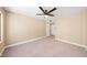 This bedroom has a ceiling fan, neutral walls, and plush carpeting at 3123 Key Largo Dr # 101, Las Vegas, NV 89120