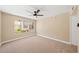 Bright bedroom features a ceiling fan and large window offering pleasant views at 3123 Key Largo Dr # 101, Las Vegas, NV 89120