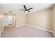 Bedroom with a ceiling fan has an ensuite bathroom and neutral decor at 3123 Key Largo Dr # 101, Las Vegas, NV 89120