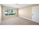 Bedroom with neutral decor, carpet, a large window and closet at 3123 Key Largo Dr # 101, Las Vegas, NV 89120