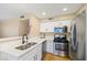 Upgraded kitchen features stainless steel appliances and sleek quartz countertops at 3123 Key Largo Dr # 101, Las Vegas, NV 89120