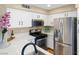 Well-maintained kitchen featuring stainless steel appliances and pristine white cabinetry at 3123 Key Largo Dr # 101, Las Vegas, NV 89120