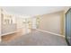 Spacious living room with plush carpeting and natural light, perfect for relaxation at 3123 Key Largo Dr # 101, Las Vegas, NV 89120