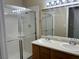 Bathroom with a double sink vanity and a glass-enclosed shower at 340 Manti Pl # 0, Henderson, NV 89014
