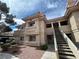 Inviting condo exterior with well-maintained landscaping and stucco finish in a sunny setting at 340 Manti Pl # 0, Henderson, NV 89014