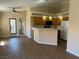 Open-concept kitchen featuring wood cabinets, breakfast bar, and modern appliances at 340 Manti Pl # 0, Henderson, NV 89014