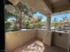 View of the patio with tile flooring, ornamental pillars, and wrought iron railing at 340 Manti Pl # 0, Henderson, NV 89014