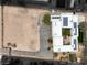 Aerial view of home with large solar panel system, courtyard and desert landscape at 3910 W Pebble Rd, Las Vegas, NV 89139